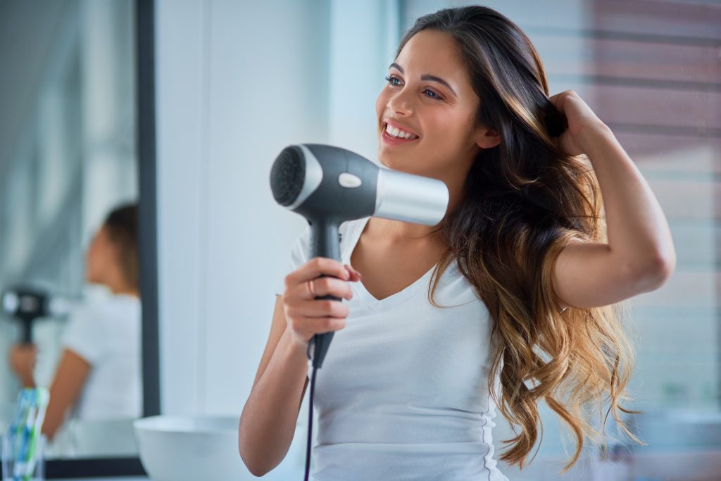 Putting great care into her hair